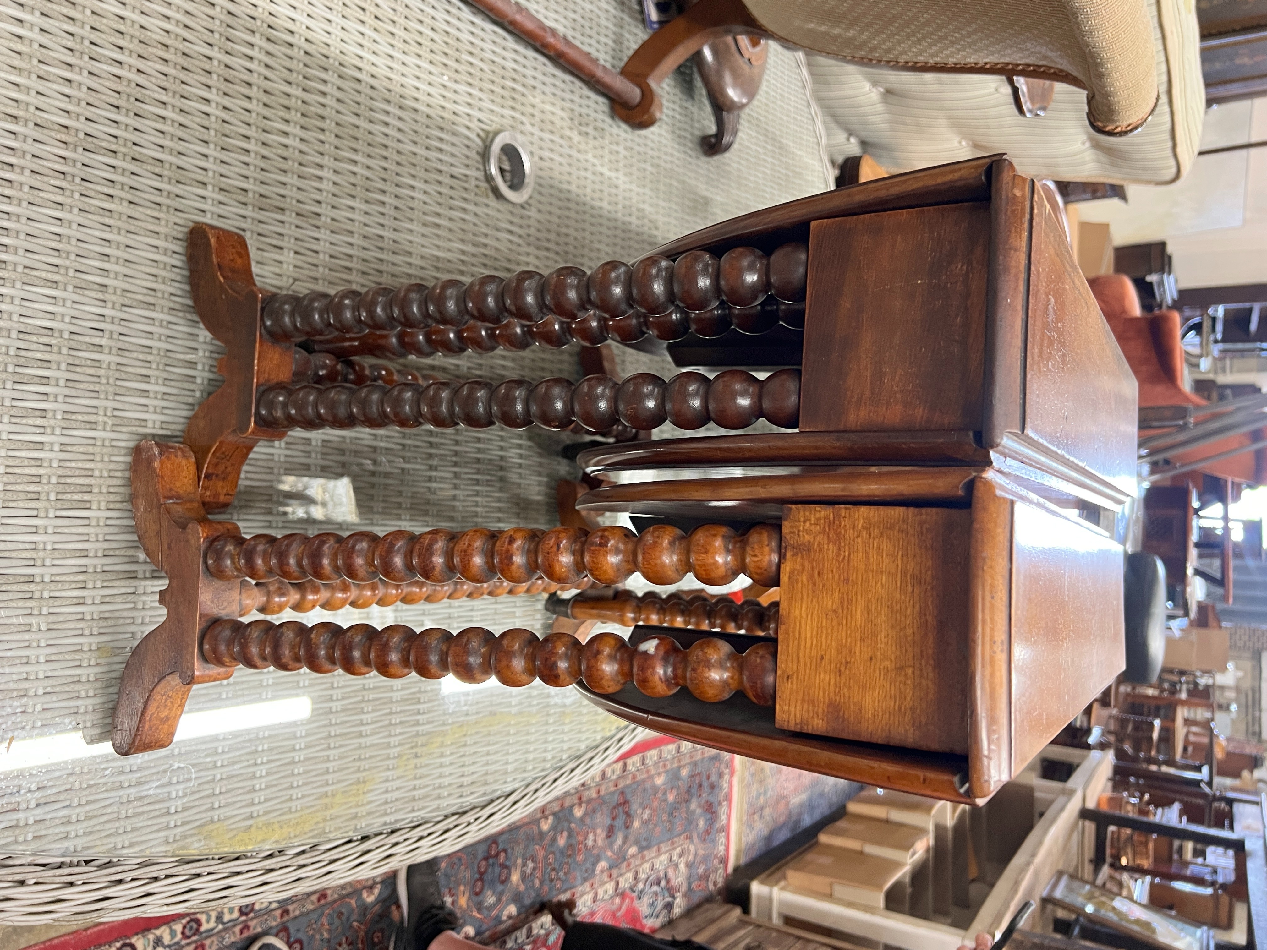 A near pair of Victorian mahogany bobbin turned Sutherland tables, width 60cm, depth 13cm, height 60cm